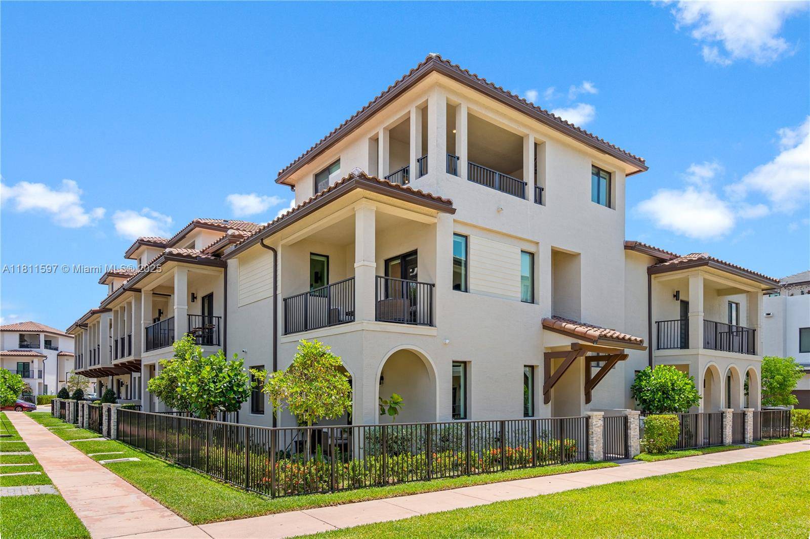 Modern 3 story corner unit townhome in Urbana at Downtown Doral with a stunning sky view terrace !