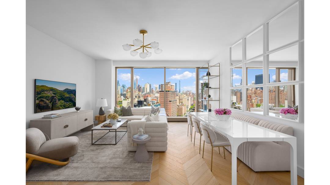 Residence East 15E is a luminous 1, 512 square foot two bedroom, two and a half bathroom home offering sweeping eastern skyline views through walls of floor to ceiling glass.