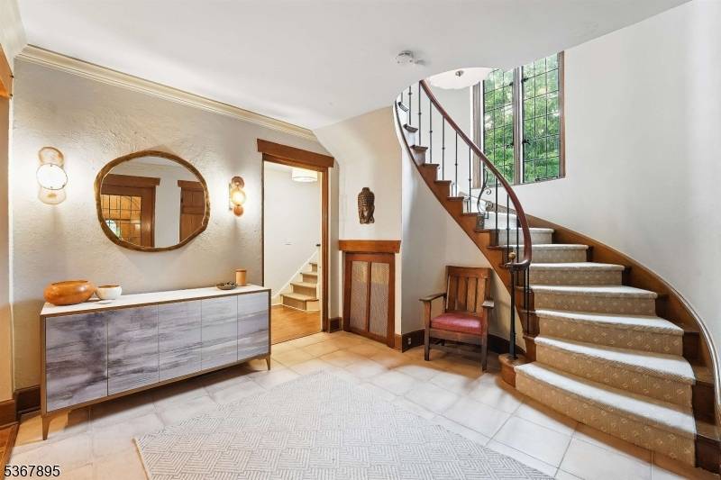 Welcome to the highly sought after Estates Section of Montclair and this exceptional Tudor, where timeless elegance meets contemporary comfort.