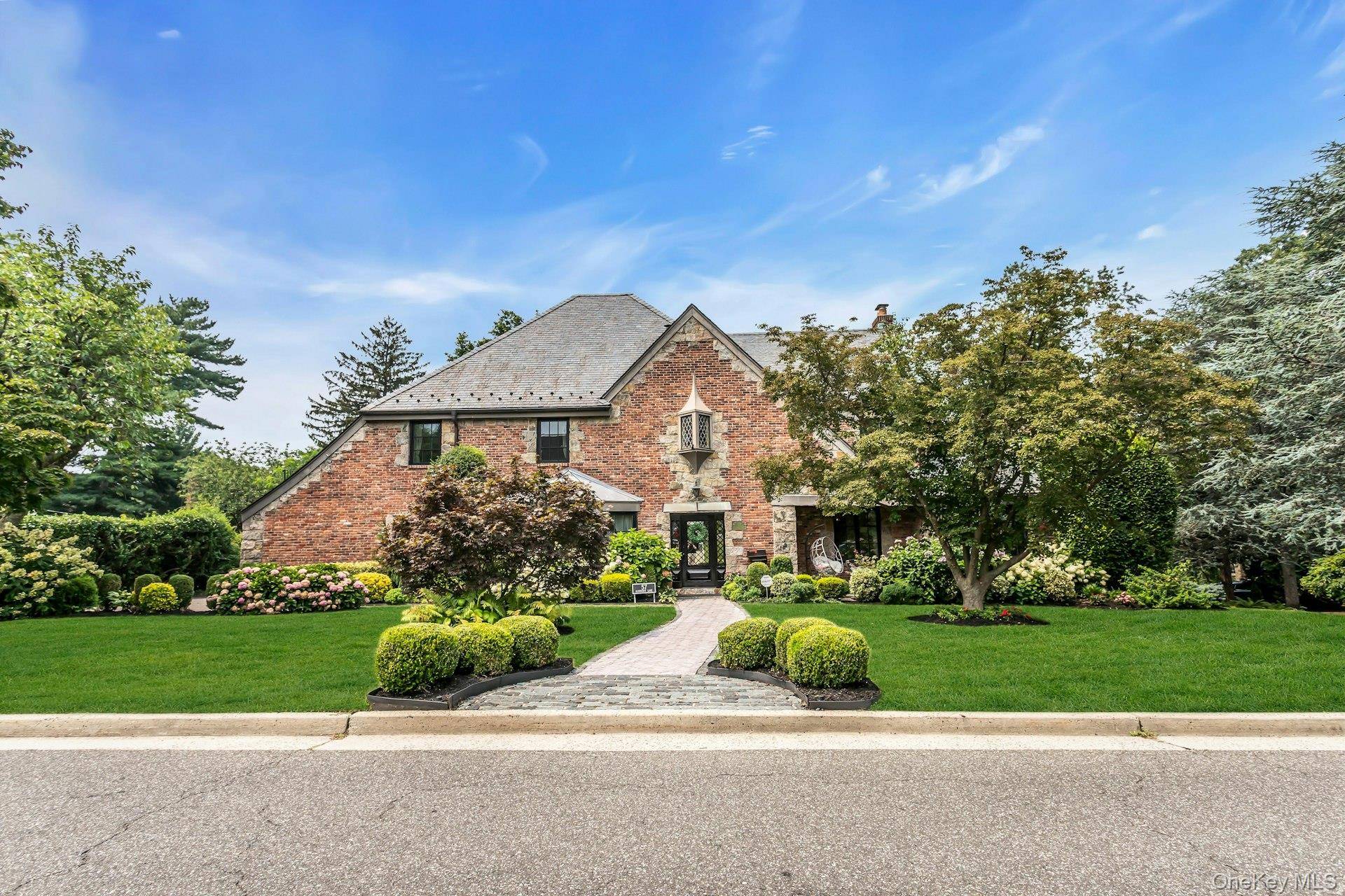 Enjoy large bright rooms and every modern amenity in this thoughtfully renovated Big Nine center hall Tudor located in Strathmore Village.
