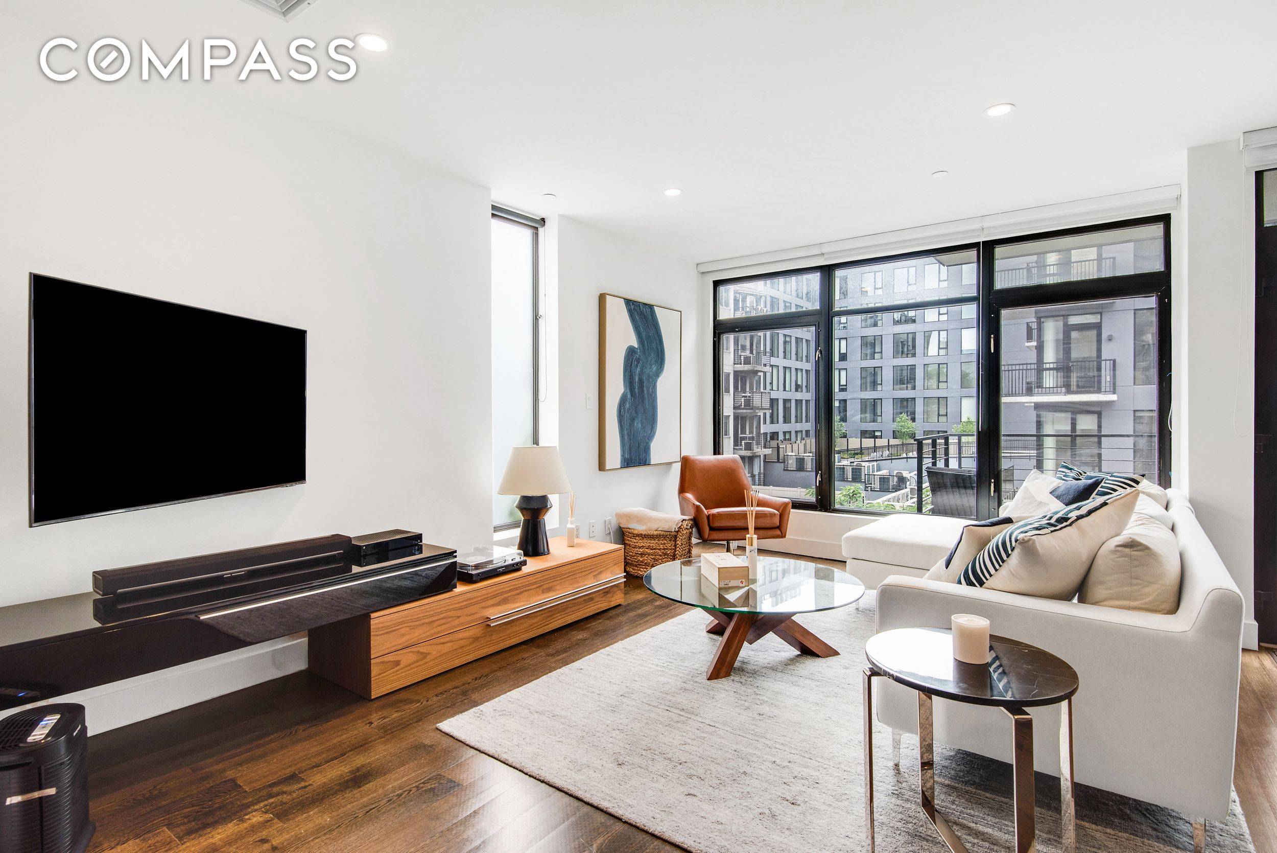 Welcome to Residence 3F at 102 Gold Street a sophisticated and sun drenched designer loft that redefines modern Brooklyn living.