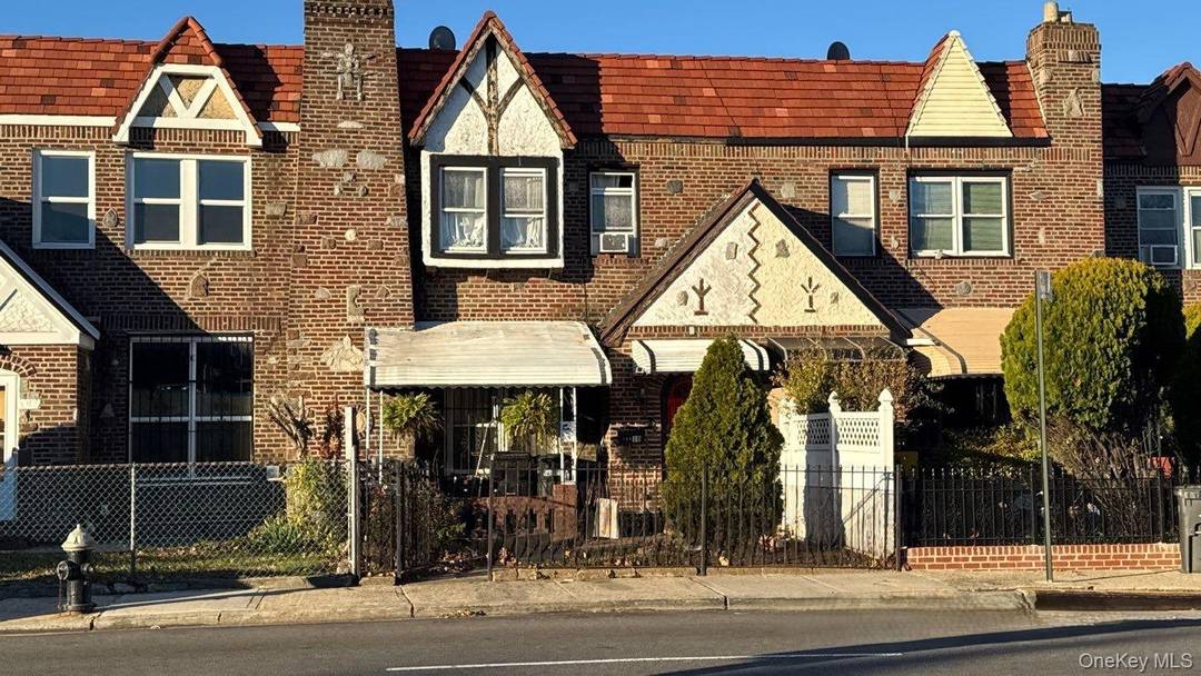 Tudor style home featuring three bedrooms, one and a half baths, a formal dining room, and an eat in kitchen.