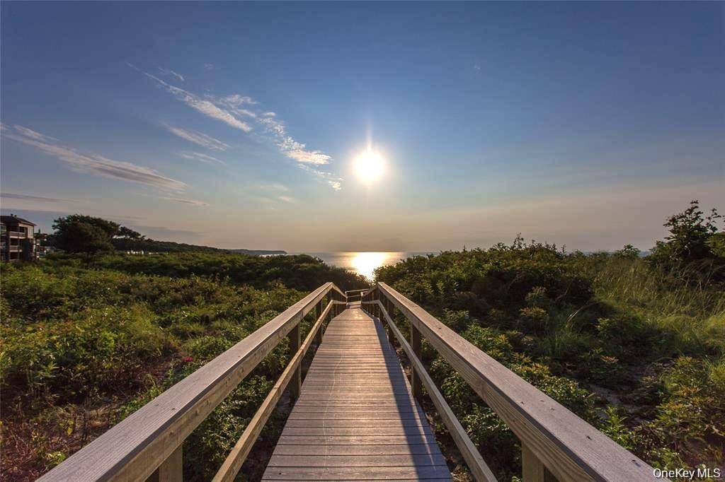 Welcome to your oasis at 3105 Bluff Drive S, Baiting Hollow NY, nestled in the waterfront community of The Knolls at Fox Hill.