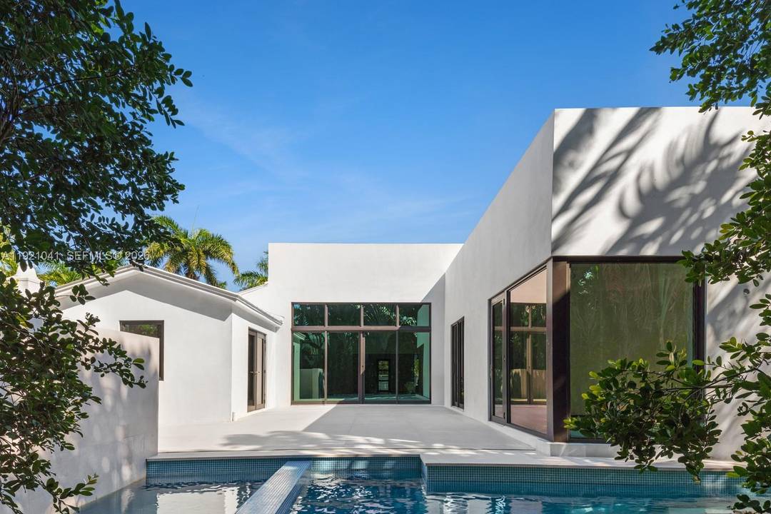 Welcome to this newly rebuilt amp ; expanded contemporary residence in the exclusive, guard gated community of Sunset Island IV.