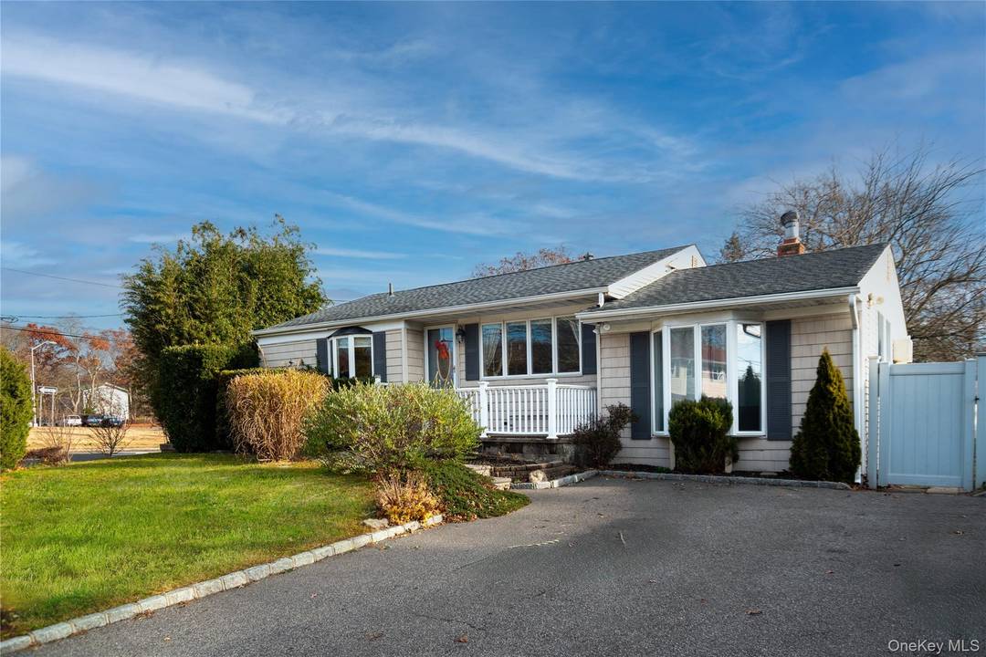 Welcome to 277 Horseblock Rd, Farmingville, A Beautifully Maintained Ranch featuring 3 Bedrooms, 2 Full Baths, Eat in Kitchen, Large Family Room with a wood burning Fireplace.