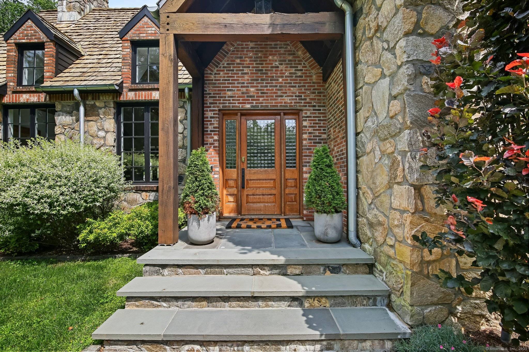 Tucked at the end of a long, private drive in a serene park like setting near the storybook village and golf course of Pound Ridge this European inspired stone cedar ...