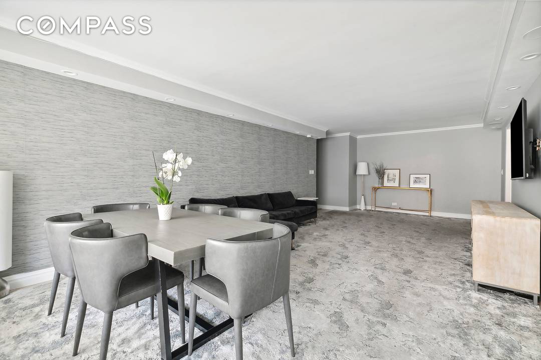 Welcome to Unit 11L at The Excelsior, a beautifully renovated chic 3 bedroom, 2.