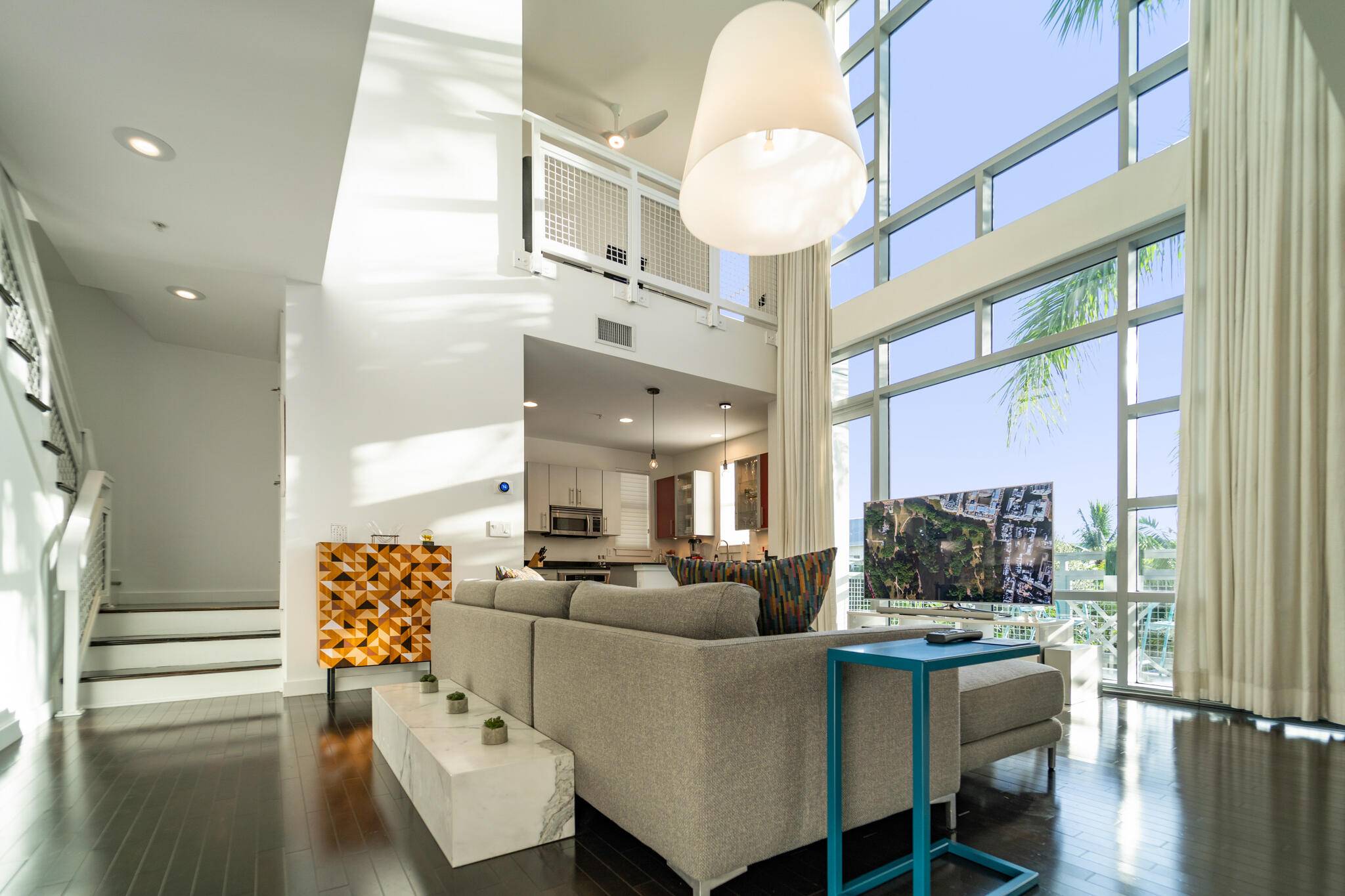 Rare two story corner penthouse in the heart of Delray Beach.