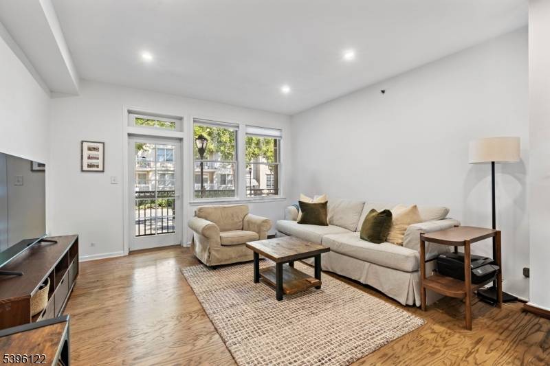 Residence 101 at 4 Constellation place is a 786 SF 1 bed 1 bath with balcony, in residence laundry, and hardwood floors throughout.