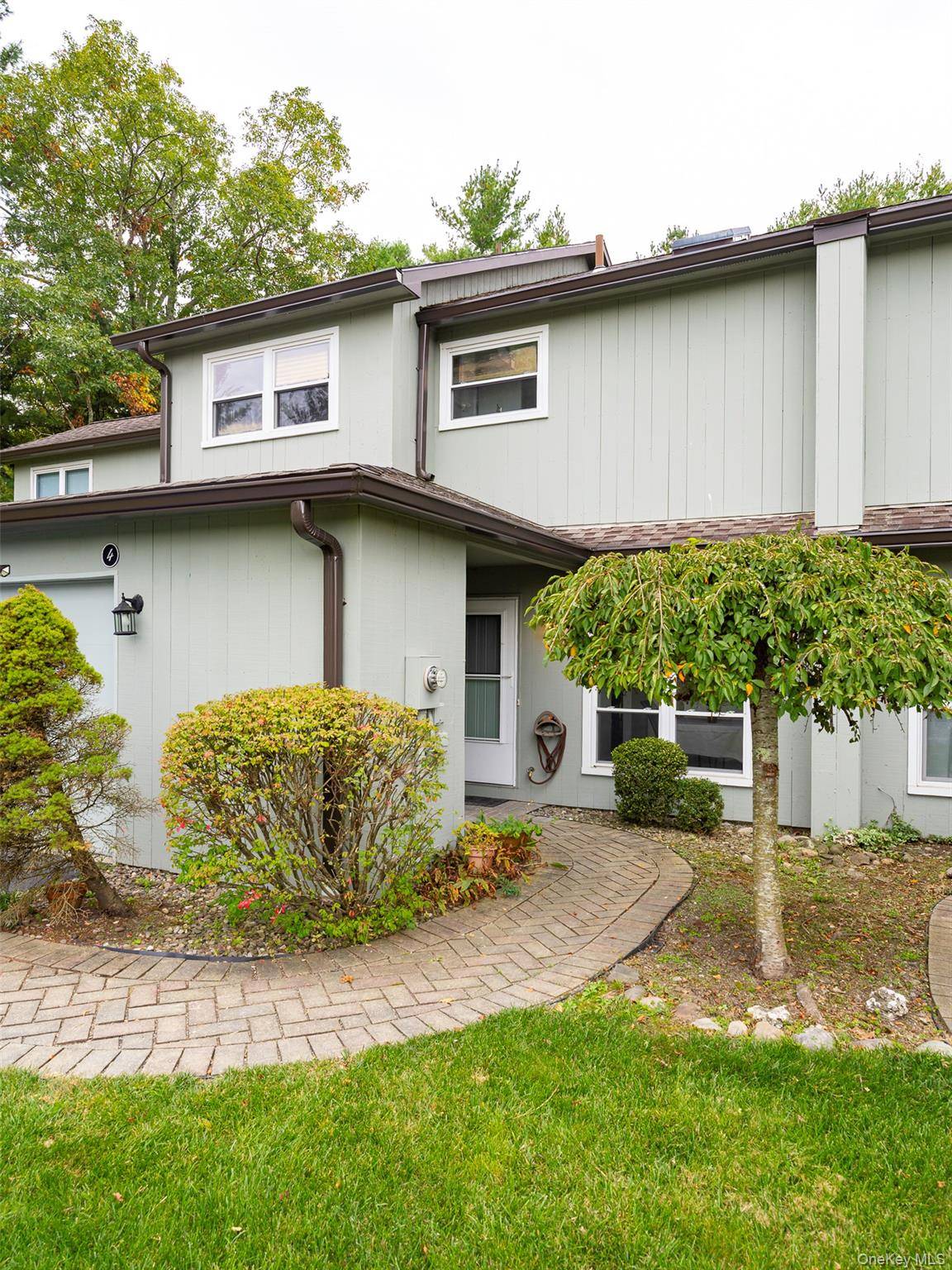Welcome to 4 Pond Drive West at The Woods, a wonderful community offering a serene lifestyle with immaculately grounds within easy walking distance of the Village of Rhinebeck Village.