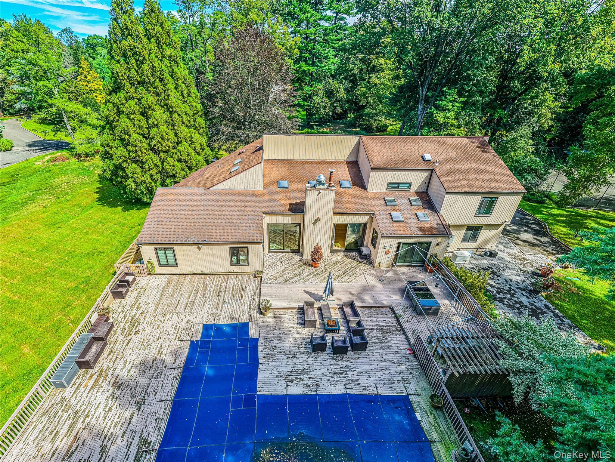 Welcome to 2 Summerwind Drive, a truly exceptional estate that combines luxury, comfort, and resort style living on 2 private acres.