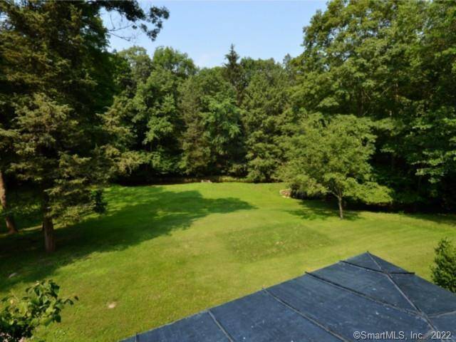 Beautiful 2 acre lot with meadow and gently flowing stream.