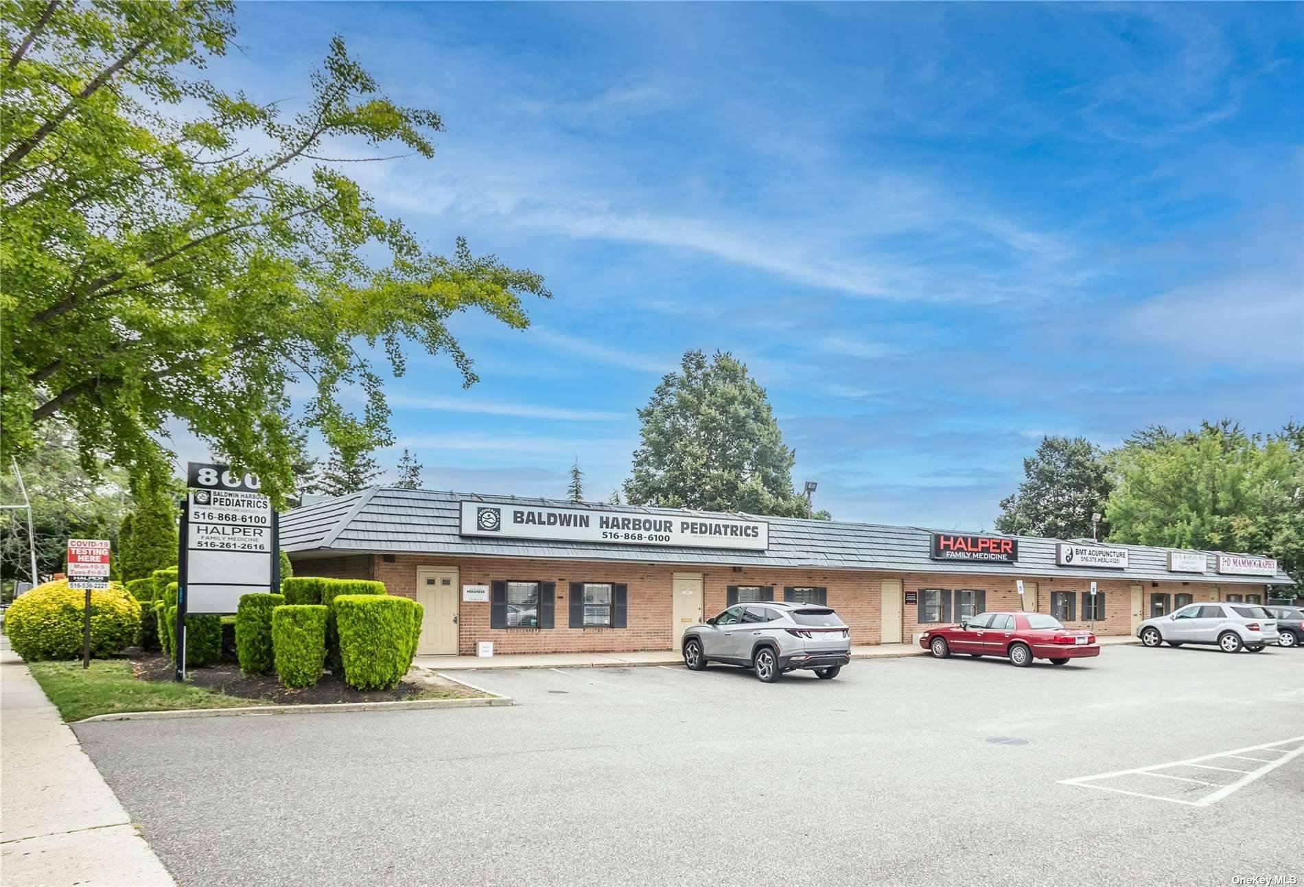 Fantastic income generating property located on busy thoroughfare with large parking lot.