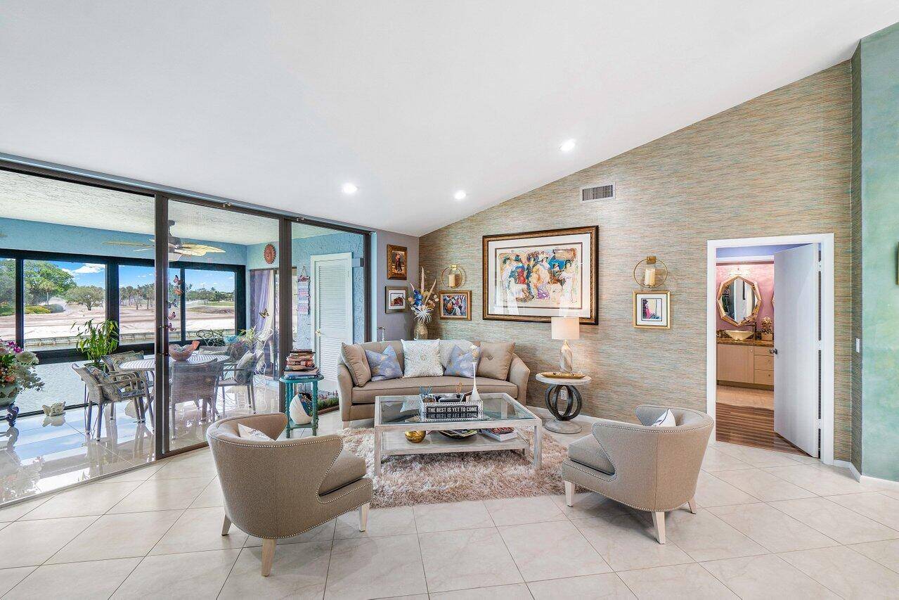 Move in ready, flex 3BR 2BA condo in desirable Eastgate at Hunters Run with spectacular golf and water views !