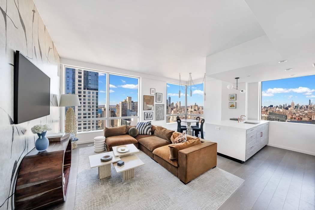 STUNNING VIEWS, 5 STAR AMENITIES AND THE LAST 25 YEAR TAX ABATEMENT Rarely available, residence 48A is a mint condition 2 bedroom, 2 bath corner home facing West and North, ...