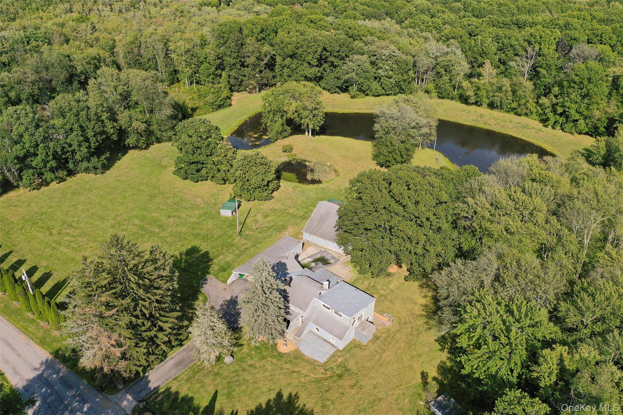Privately situated on 4 acres and at the end of a quiet cul de sac, find this custom contemporary.