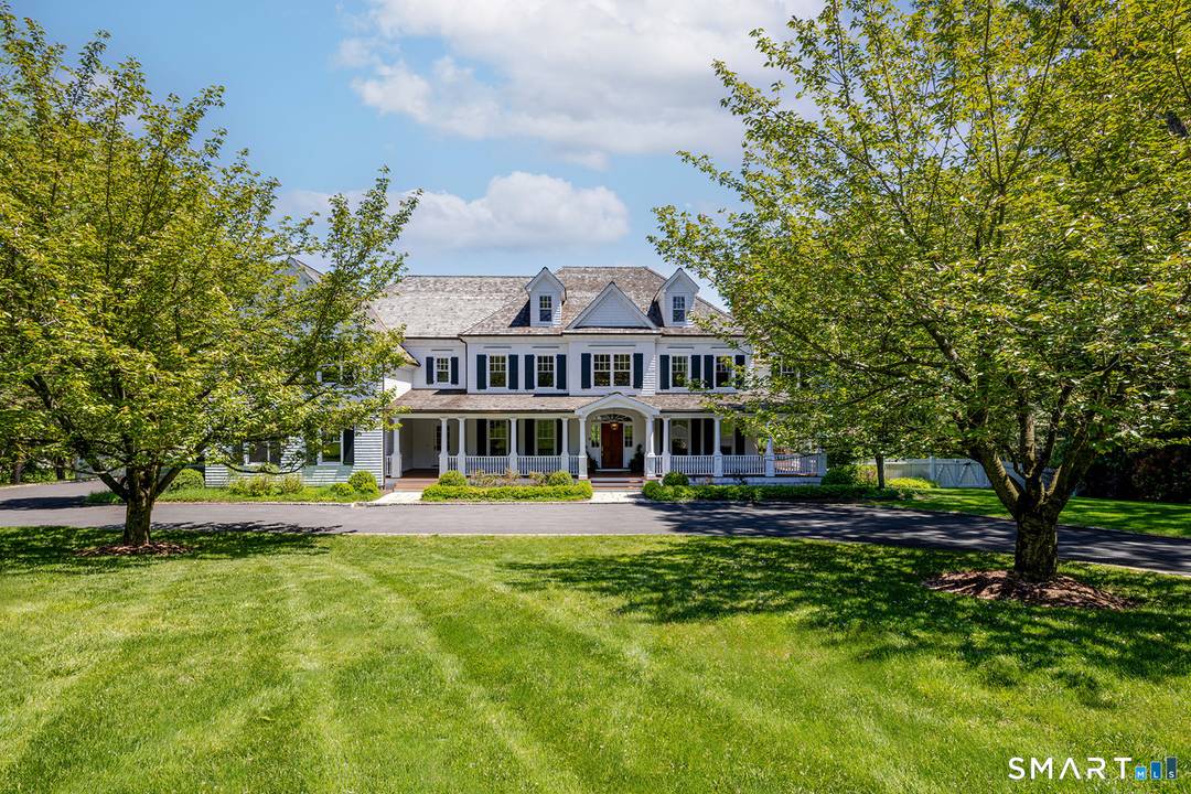 Privately tucked away at the end of a long circular drive on 6 acres, this exceptional country estate blends timeless elegance with the warmth and comfort of everyday living.
