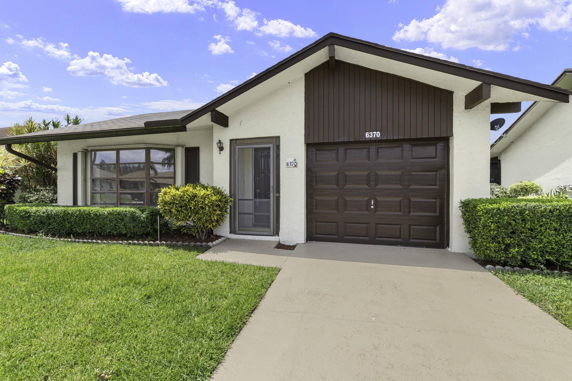 Welcome to your new home in the desirable Buttonwood 55 community nestled in the heart of Greenacres.