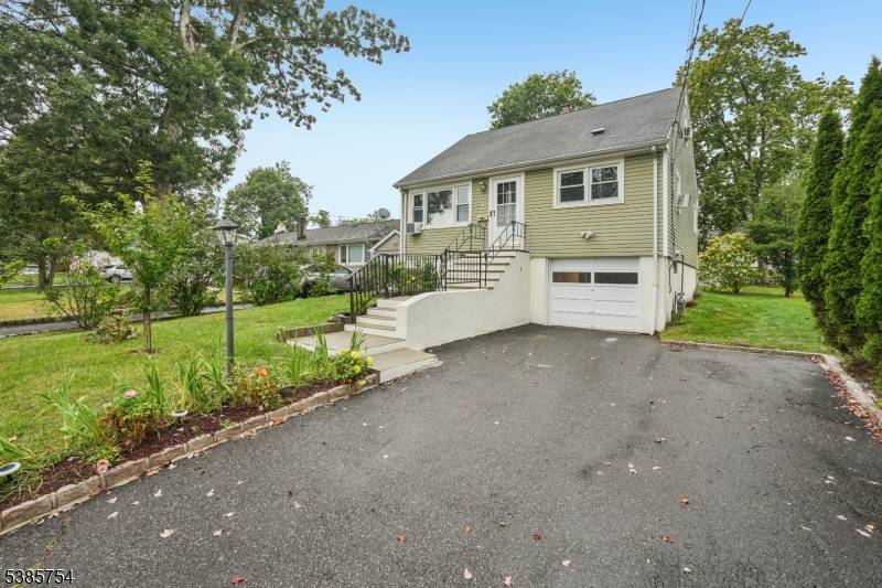 This charming Cape Cod offers storybook curb appeal with picturesque landscaping, a level lot, and valuable updates including roof, siding, and front walkway steps.