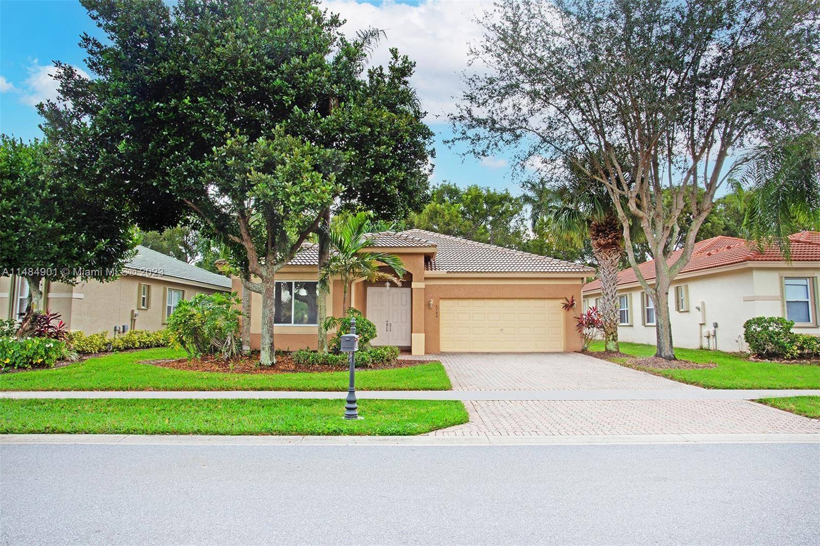 NOW'S YOUR CHANCE TO OWN THIS WELL MAINTAINED AND BEAUTIFUL HOME WITH NEW ROOF IN VENETIAN ISLES 55 COMMUNITY.