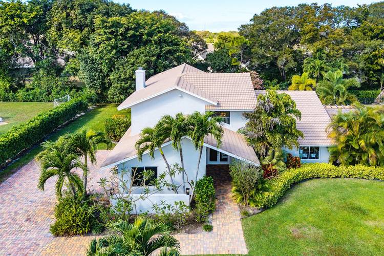 Move in ready spacious, comfortable family home in the guard gated prestigious community of Pine Tree Country Club Estates.