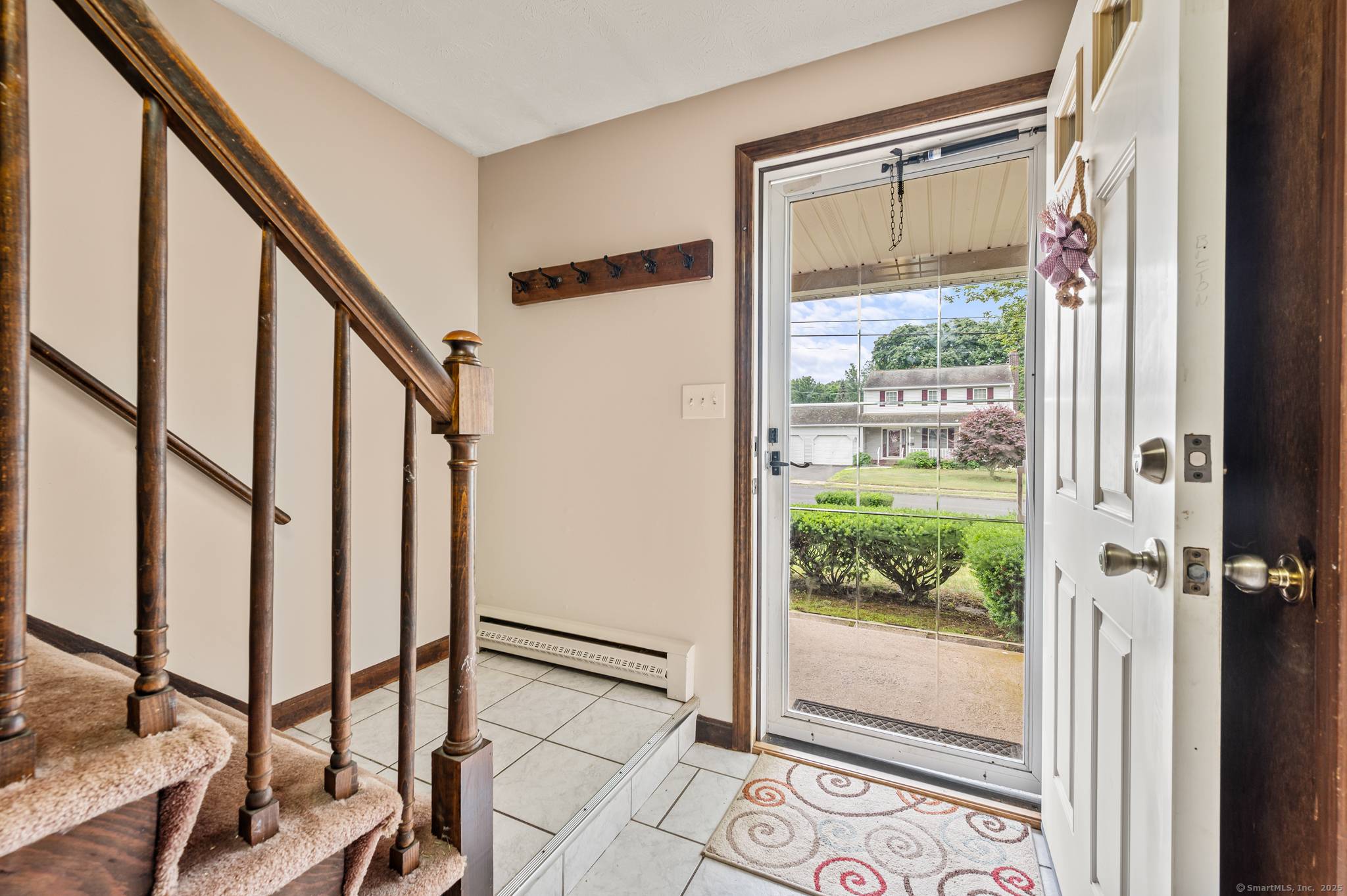 Spacious 4 Bedroom Colonial with complete In Law, Au Pair or Family Living with separate exterior entrance and private door into the Home.