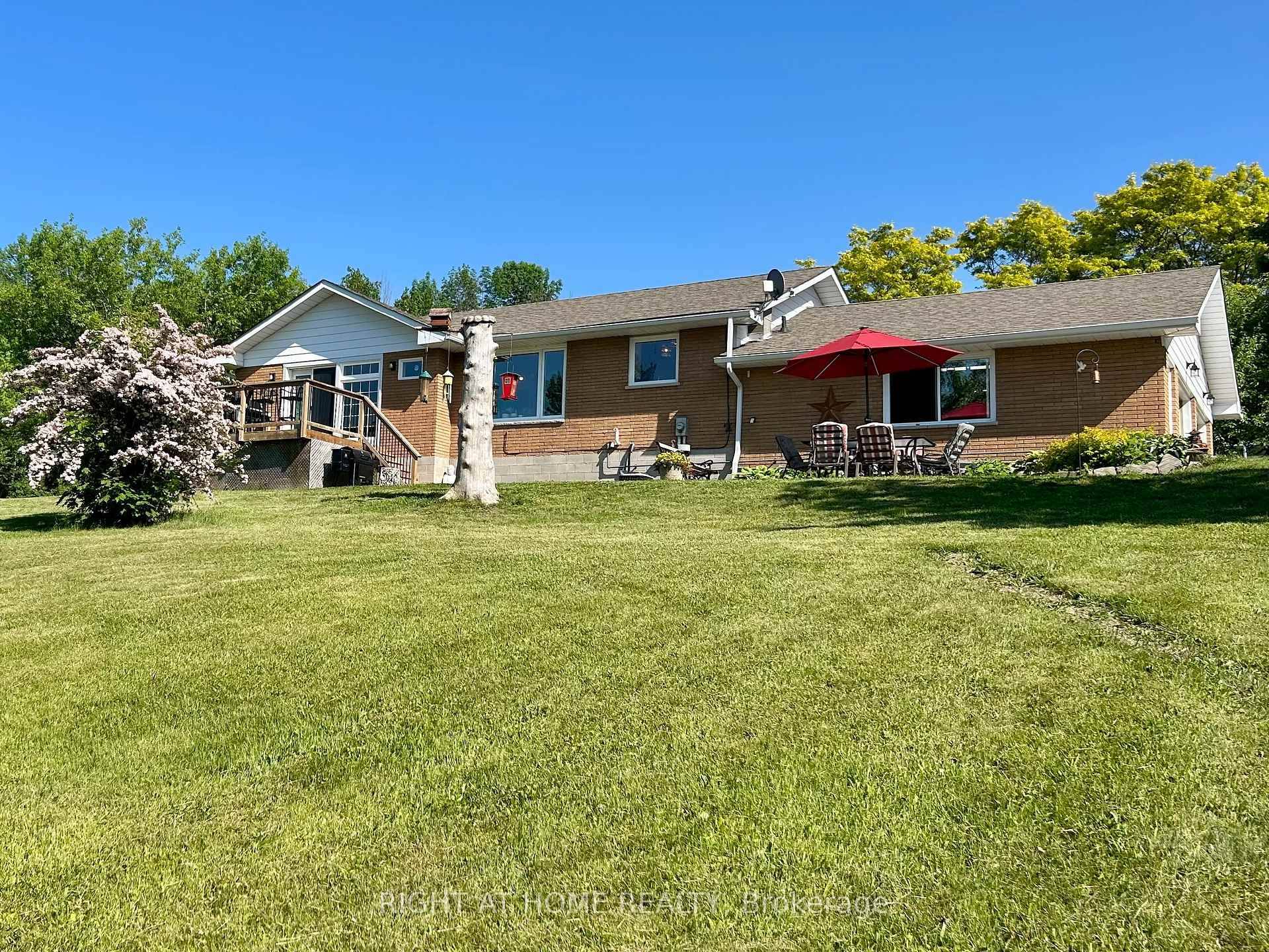Beautiful 3. 15 Acre lot with gorgeous views, gardens and new stamped concrete patio.