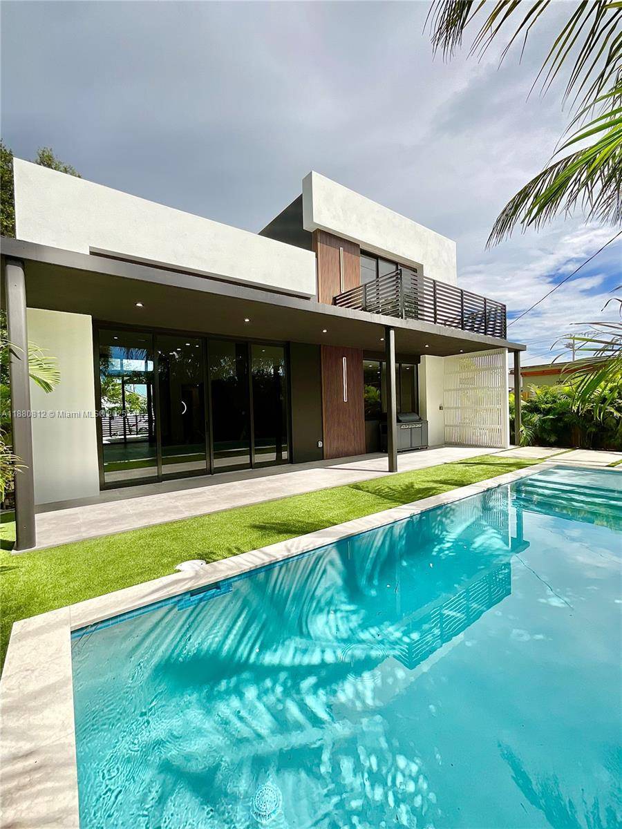 This stunning 2 story, residence is a modern masterpiece that seamlessly blends bold design with refined elegance.