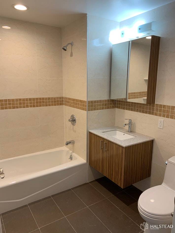 Brand new large 2 bedroom 2 bathroom apartment with balcony in this new elevator condo building situated only 1 block away from Sunset Park.