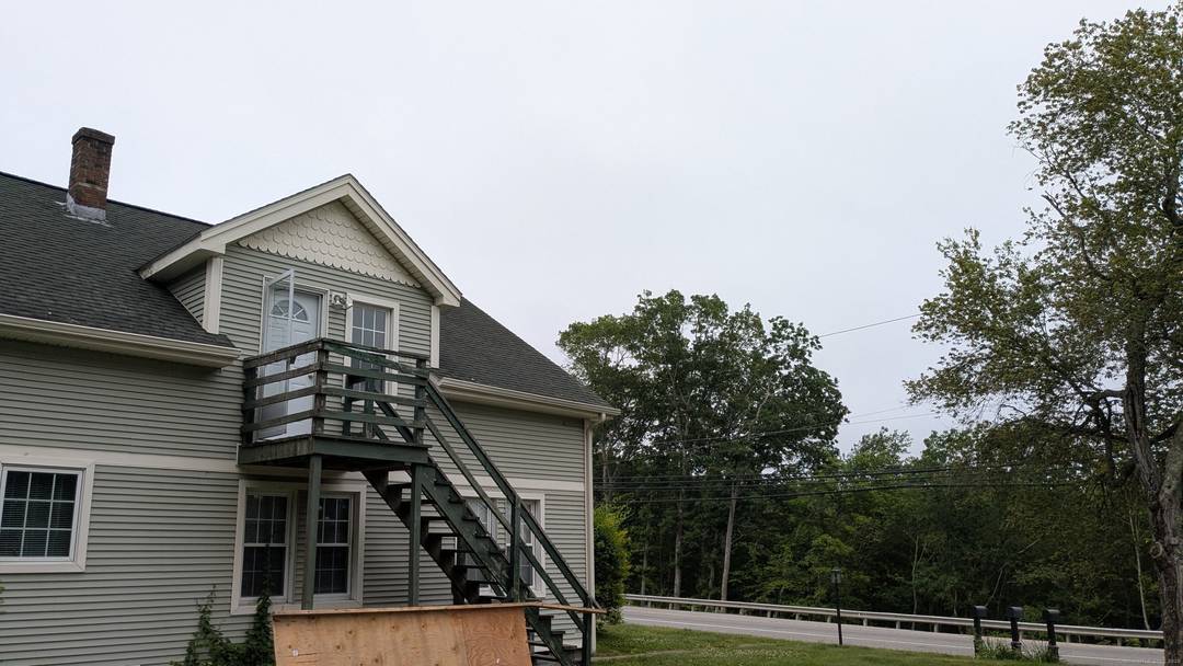 Property includes a 2 family home and a 40' x 80' steel building.