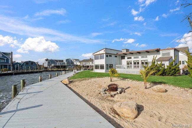 Frank Lloyd Wright inspired Waterfront Contemporary in Amityville Village set on nearly 250 feet of combined bay amp ; canal frontage.