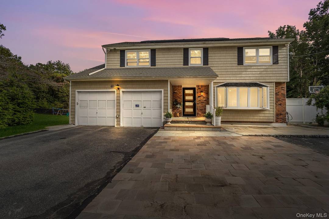 Beautifully remodeled from top to bottom, this stunning Colonial sits proudly on a rarely available 1.