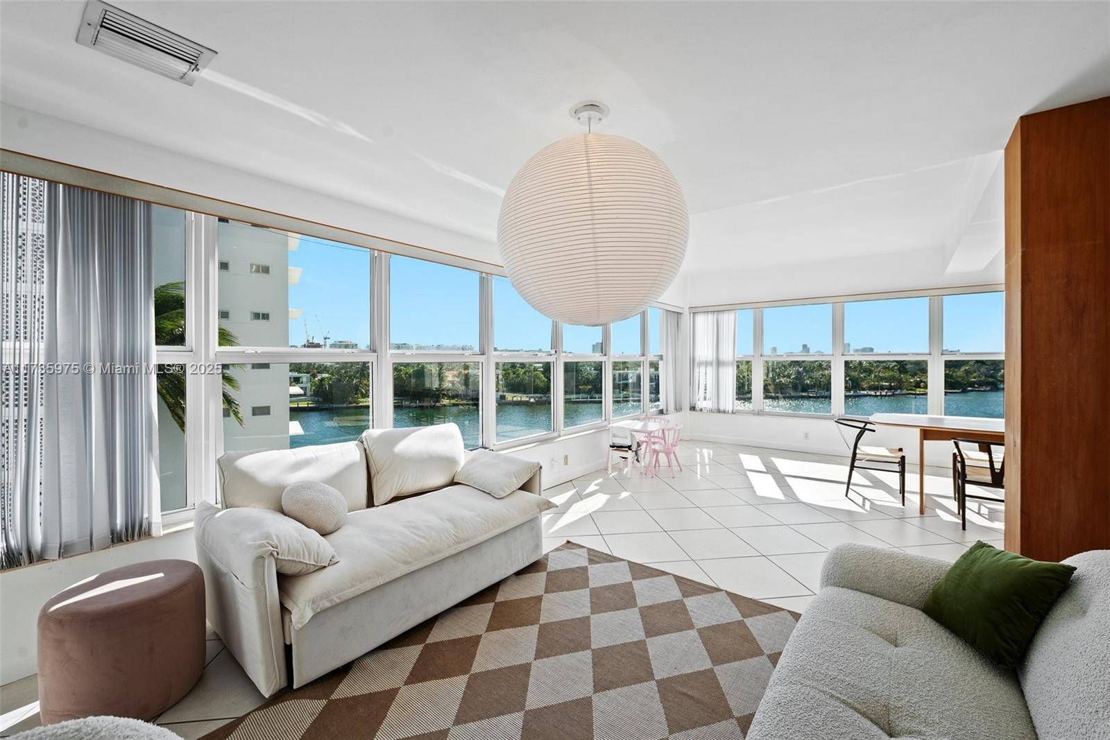 Spectacular and spacious unit at The Blair House in Bay Harbor Islands with breathtaking views upon entering.