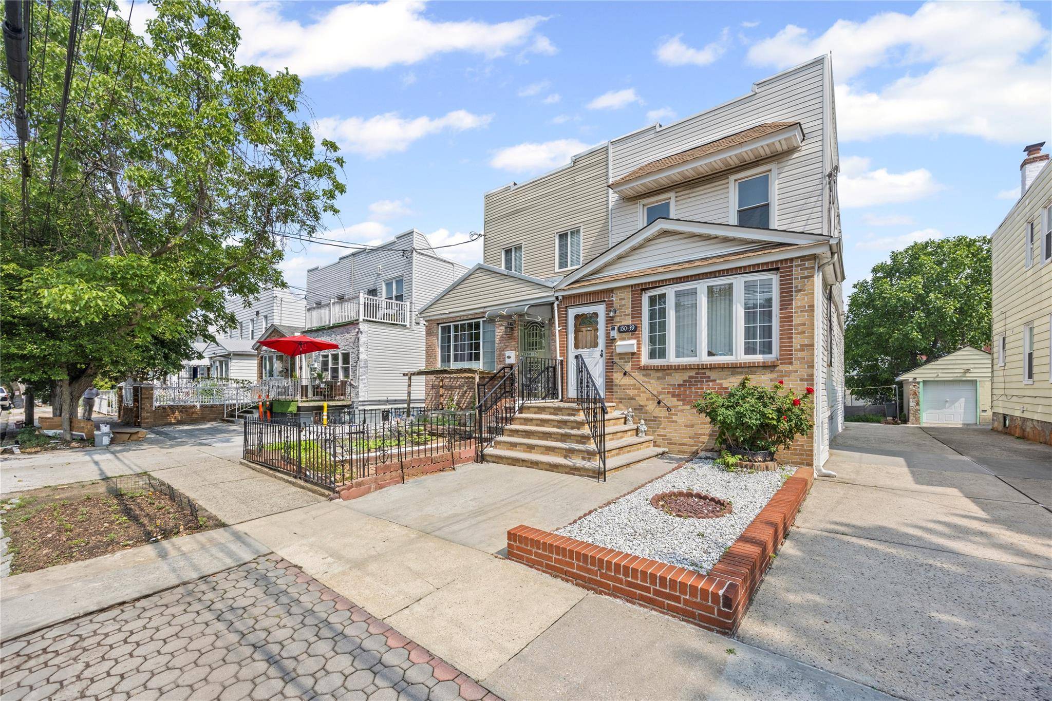 Welcome to this exquisite legal two family residence in the heart of Briarwood, Queens.