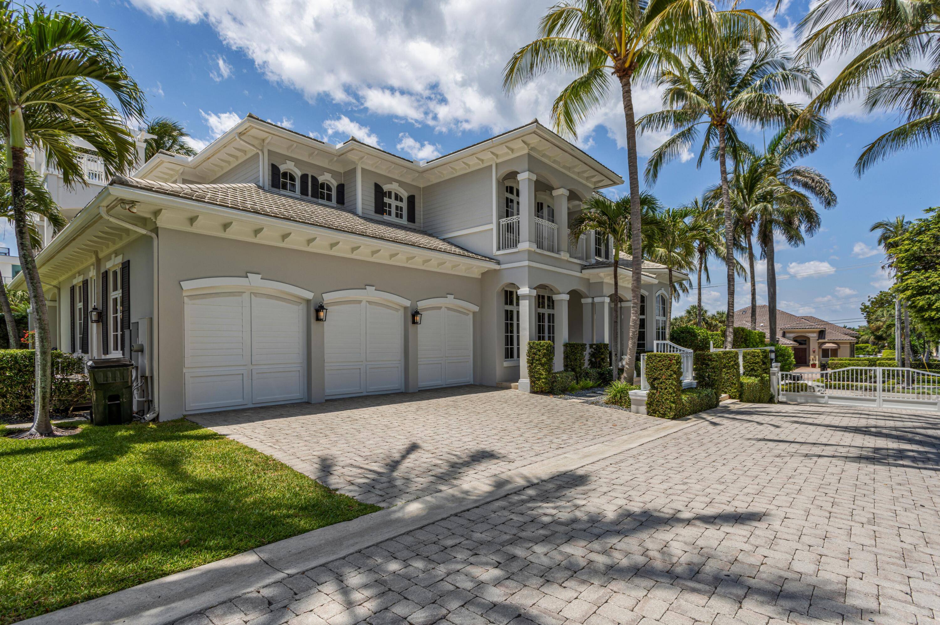 This Delray Beach residence, in a private, oceanside, three estate gated community, offers deeded beach access via its own private beach path.