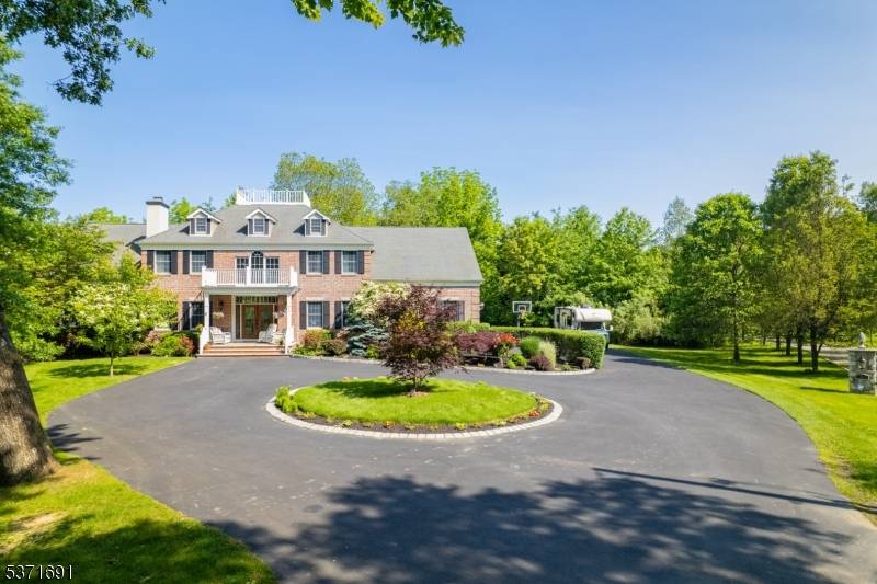 Welcome to this Stately brick front Colonial offering nearly 5, 000 sq ft of luxury living on 3 picturesque private, level acres.
