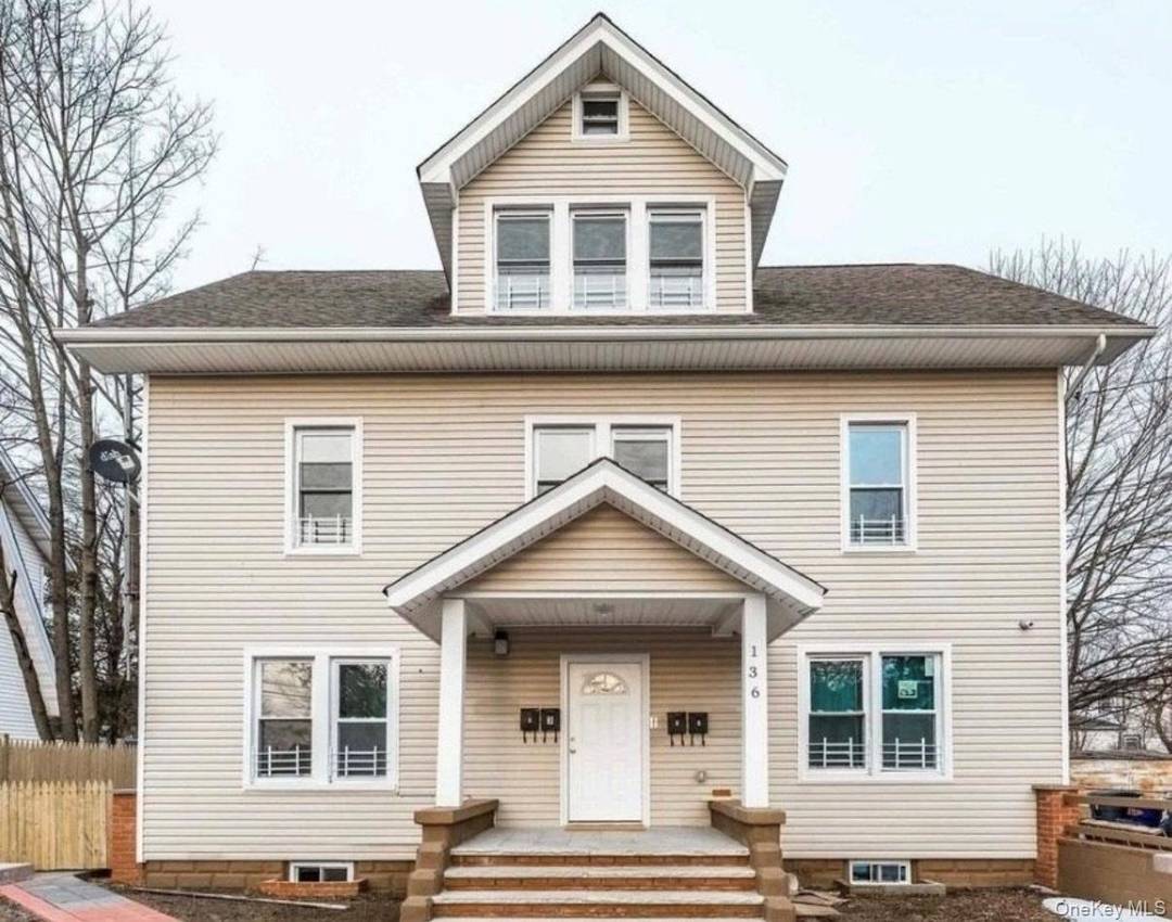 Recently renovated, this legal four family home is situated in the heart of Hempstead.