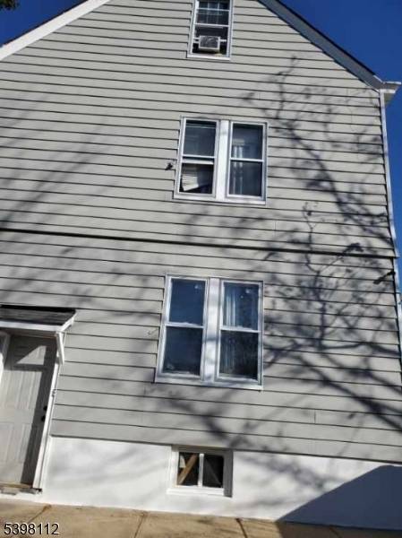 This two unit home has 5 rms on each floor, Lr, Dr, Eik, Ct Bath, two Br's, Hardwood floor in each room.