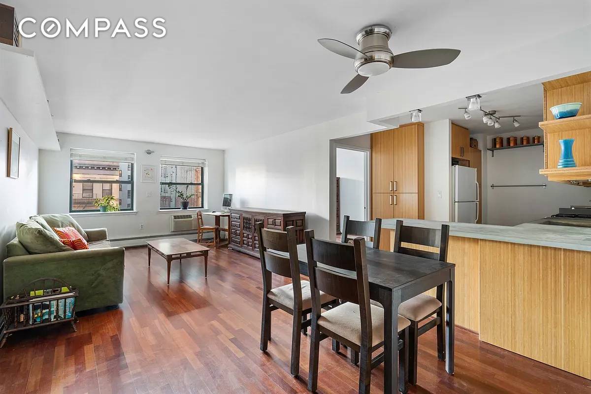 This home has undergone an environmentally conscious kitchen renovation, featuring sustainable materials such as solid bamboo cabinetry, Marmoleum flooring, and custom designed concrete sink and countertops.