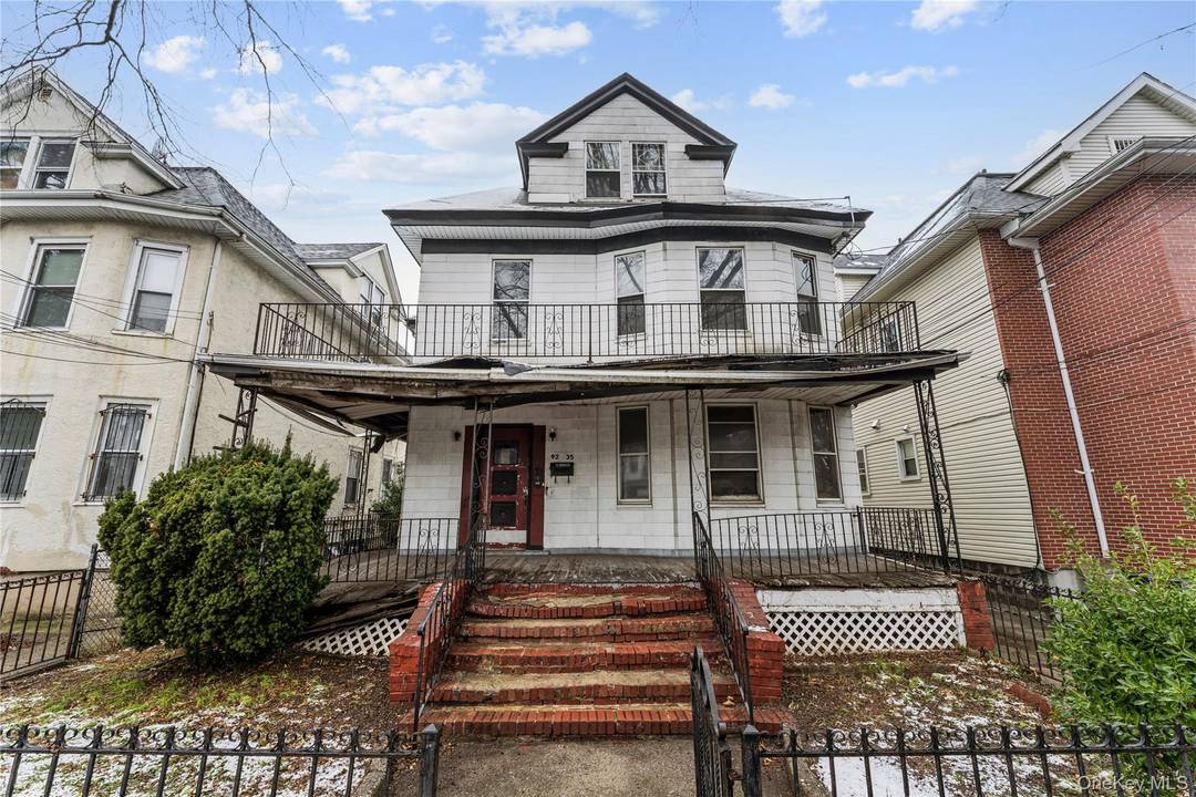 Large three family home in a prime Elmhurst location offering exceptional space and flexibility.