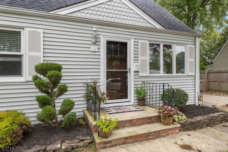 Welcome to this updated 4 Bedroom Cape Cod meets modern living.