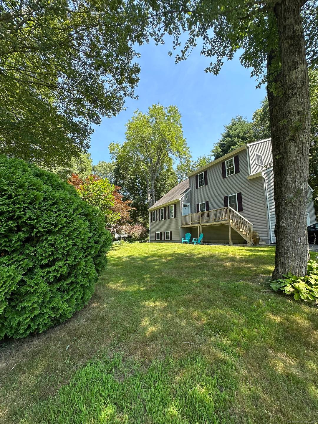 Welcome to this beautifully maintained Colonial Contemporary home, set on a generous 1.