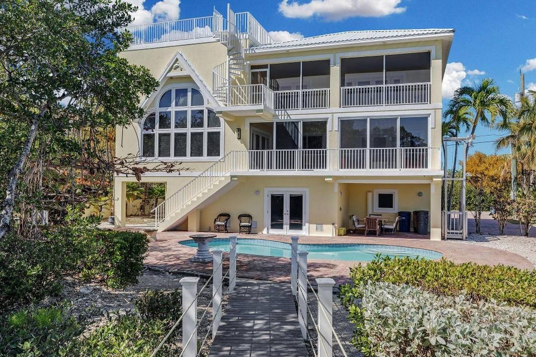 A rare estate package opportunity in the gated community of Stirrup Key, this four story Luxury Custom residence is offered with a separate vacant lot with its own Parcel ID, ...