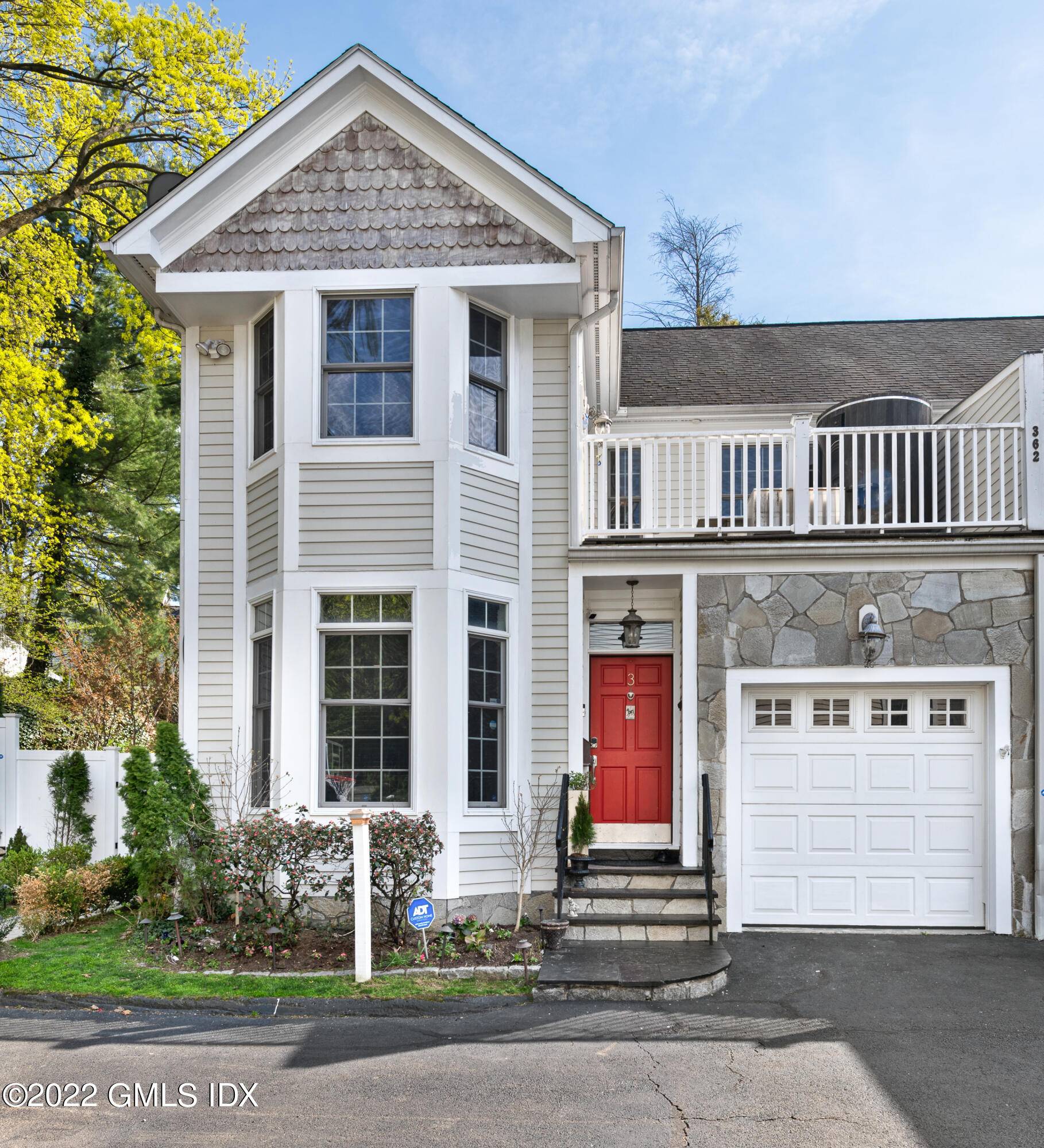 Luxury townhouse in downtown Greenwich with stunning tiered private Japanese garden w cascading waterfall and Koi Pond.