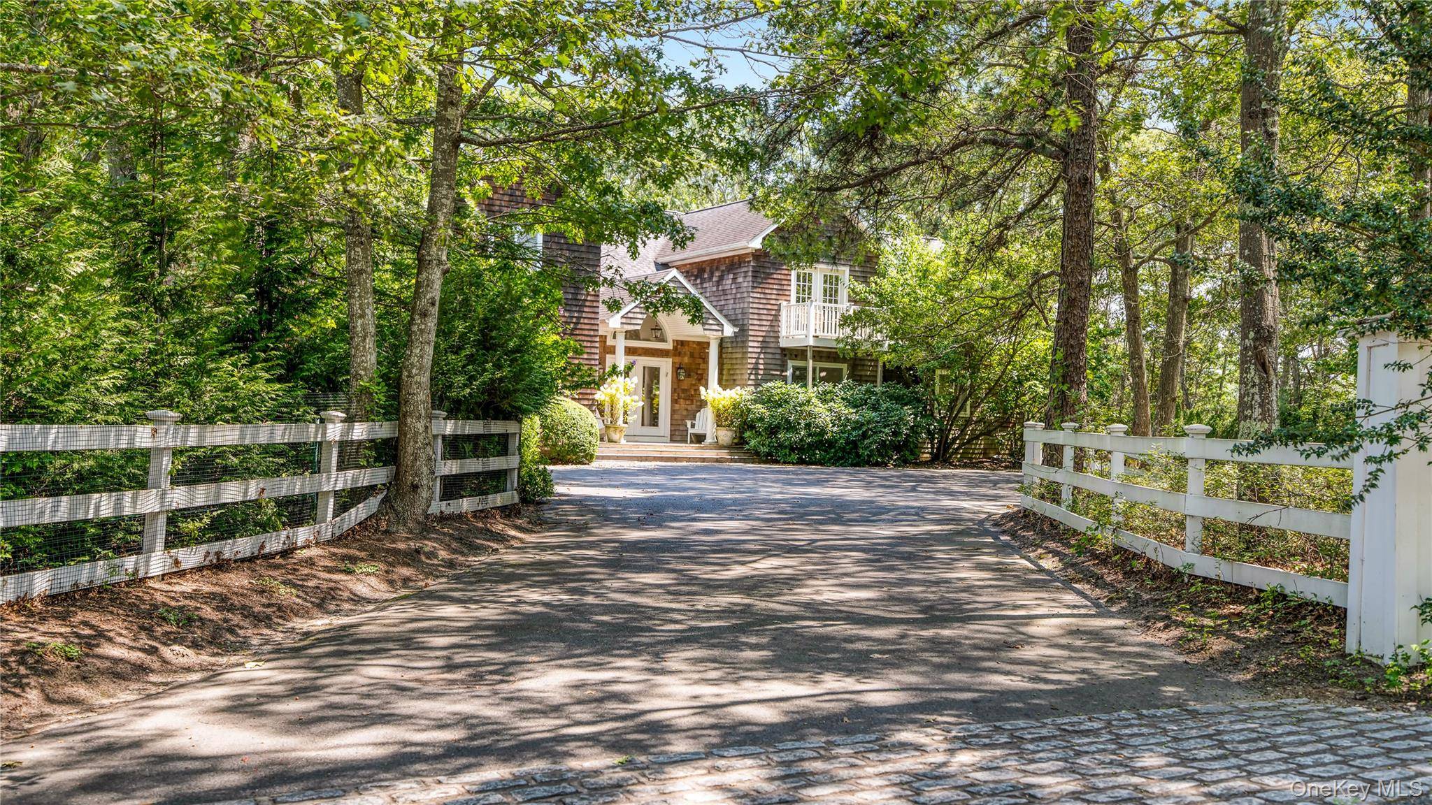 Quogue Village Ultimate Retreat Enjoy resort style living at its finest in this exceptional Quogue Village residence, nestled on 2.