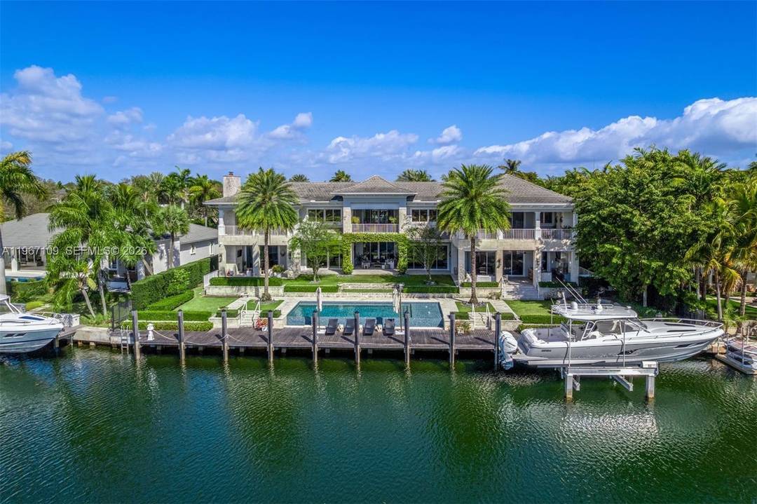 Elegant Coastal Mediterranean inspired waterfront estate within the exclusive, guard gated enclave of Old Cutler Bay in Coral Gables.