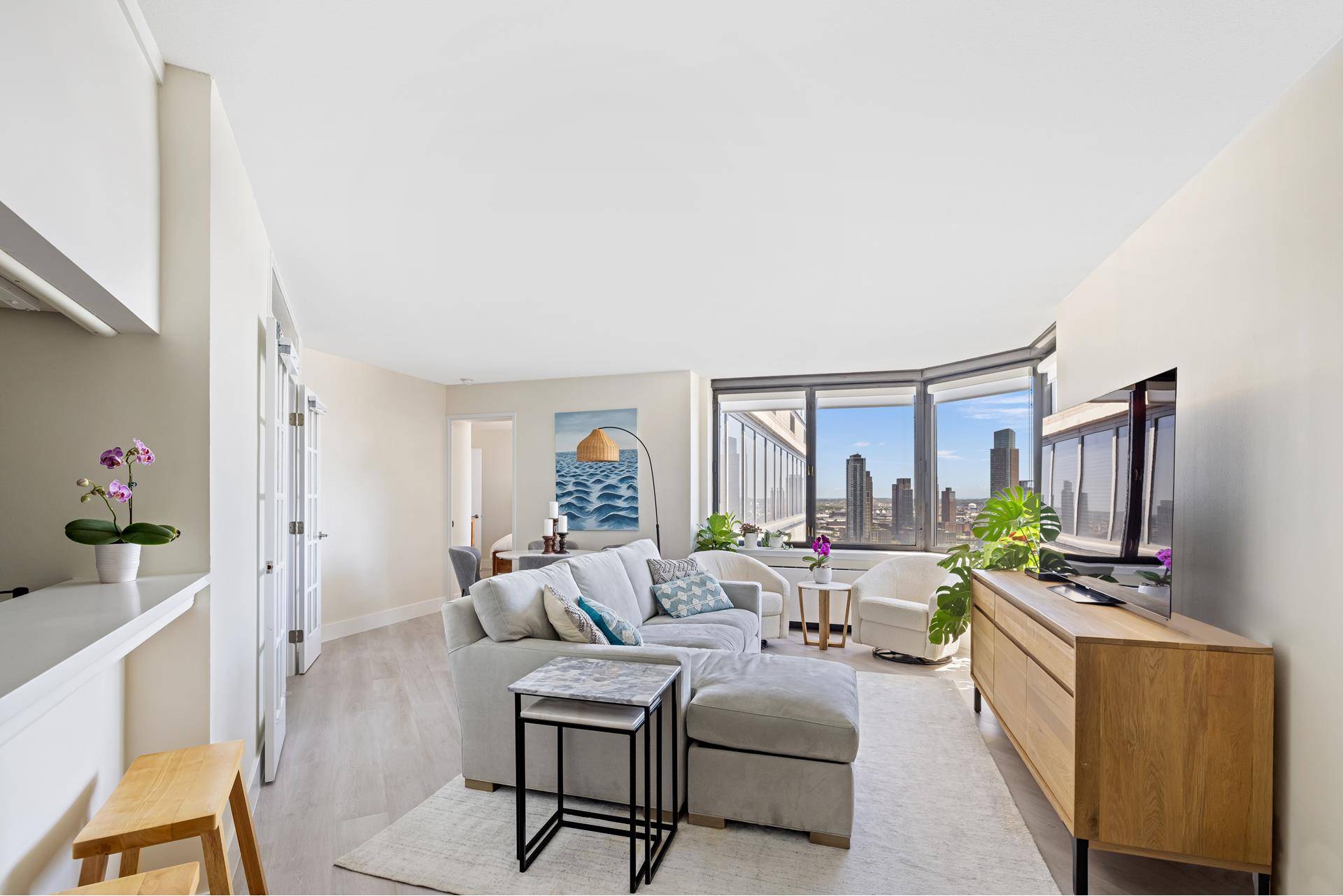 Enjoy sweeping, unobstructed East River Views from this exceptional, South facing, high floor D line corner, 1 bedroom plus den, 2 bathroom residence at the luxurious Horizon Condominium.