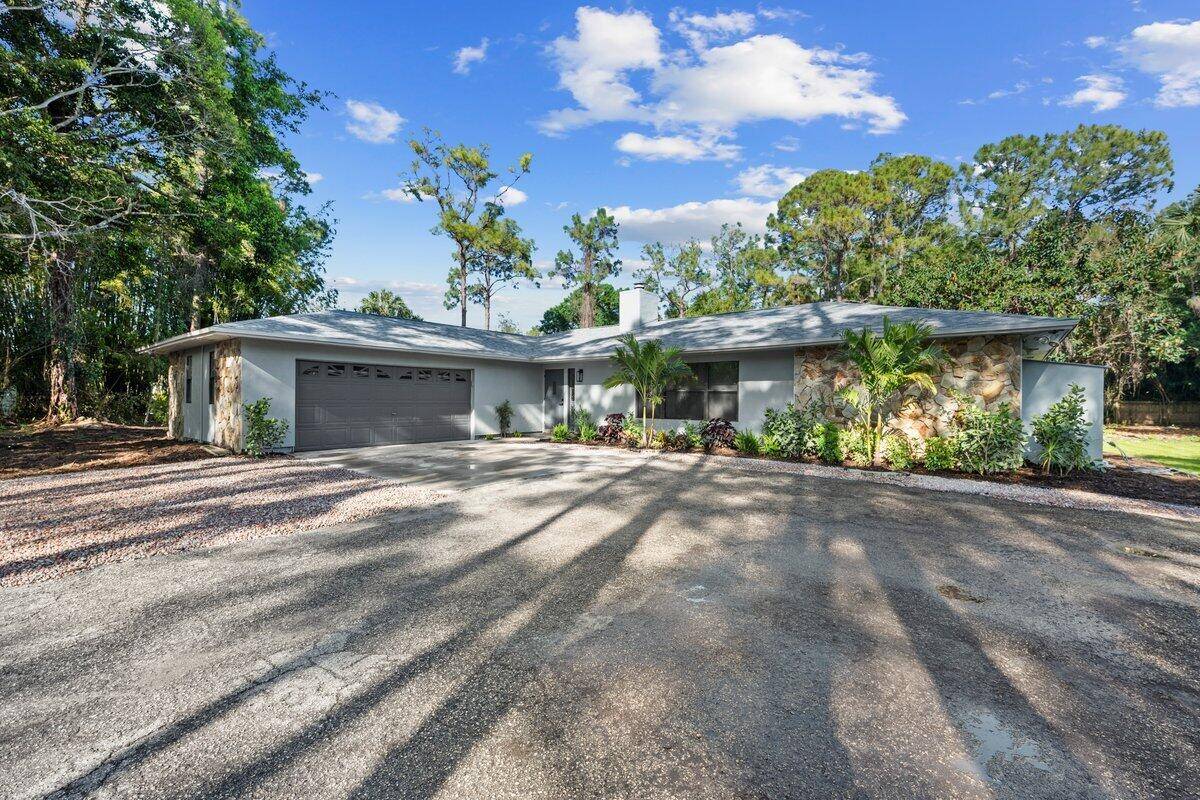 Welcome to your dream home in the highly sought after Jupiter Farms !
