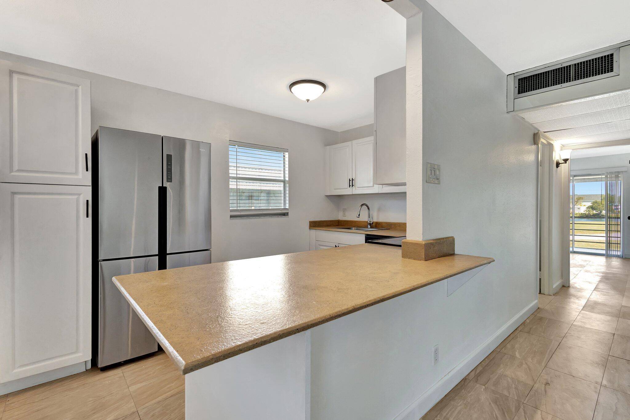 Discover the perfect blend of comfort and style in this beautifully updated 2 bedroom, 2 bathroom second floor condo in the highly sought after Kings Point community.