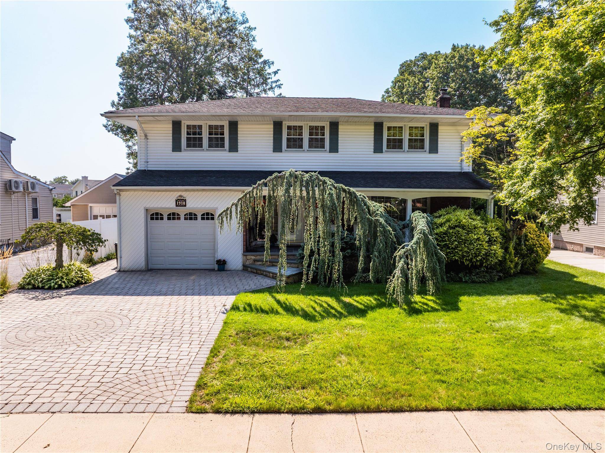 Welcome to 1918 Lenox Ave, East Meadow An updated Center Hall Colonial with Resort Style Living This spacious 2, 200 sq.